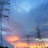 transmission tower under gray sky